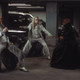 the twins battle morpheus in a parking garage
